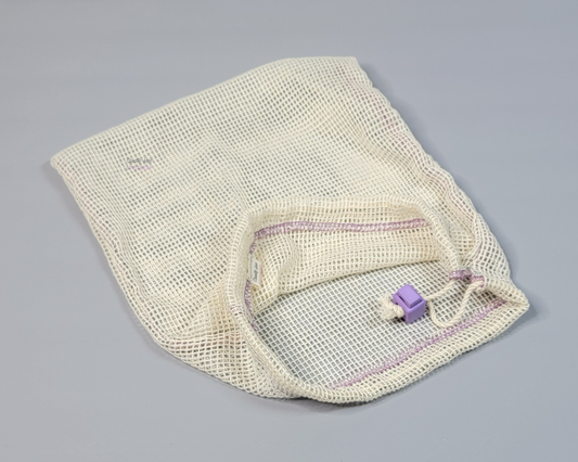 An off-white cotton mesh bag. Drawstring closure with a light purple square cord stop.