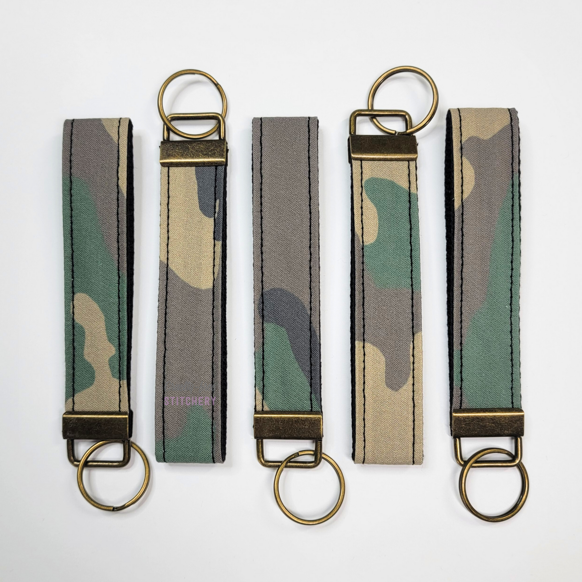 Camo print key fobs in alternating directions. 