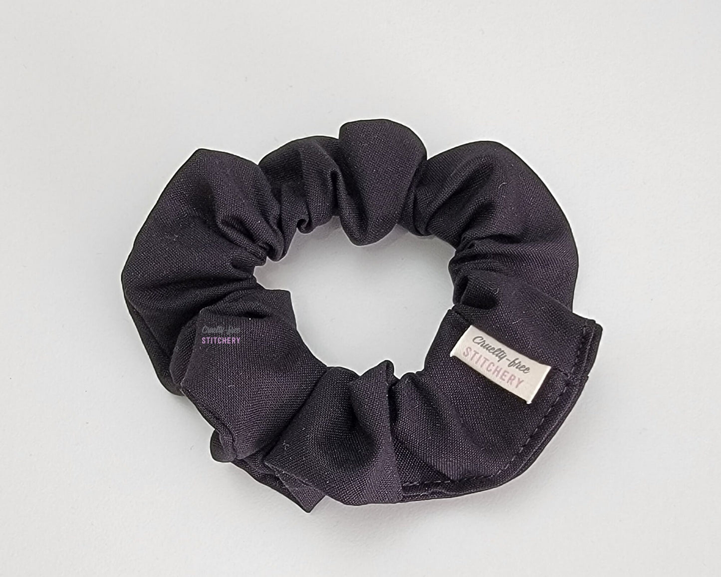 A solid black scrunchie.