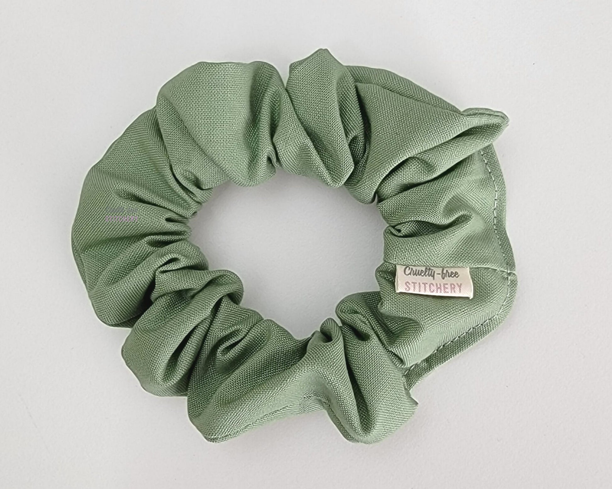 Light sage green scrunchie.