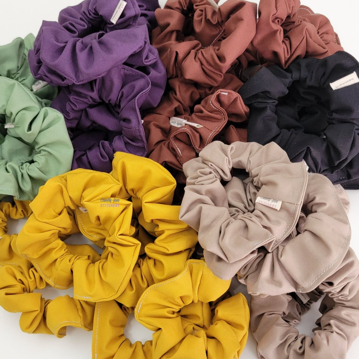 A large pile of assorted solid color scrunchies.