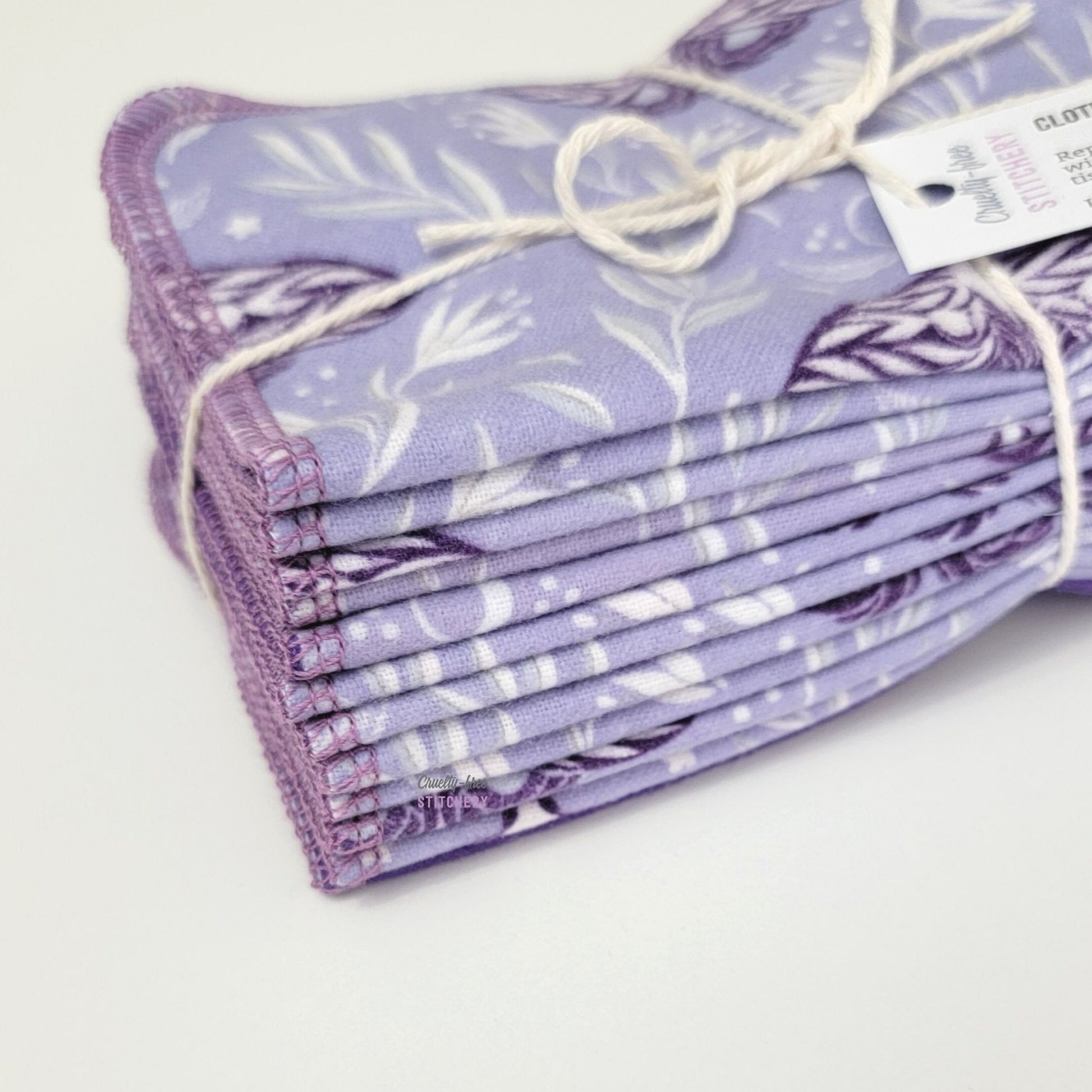 Close-up of the folded purple moths cloth wipes.